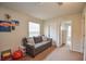 Versatile playroom with comfortable couch and ample storage at 4762 White Sanderling Ct, Tampa, FL 33619