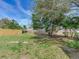 Spacious backyard with a large tree and fence at 10463 118Th Ave, Largo, FL 33773