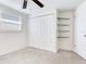 Bedroom with built-in shelving, double door closet and ceiling fan at 10463 118Th Ave, Largo, FL 33773