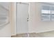 Bright entryway with tile floors and white door at 10463 118Th Ave, Largo, FL 33773