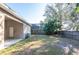 Fenced backyard with mature trees and grass at 10721 Rockledge View Dr, Riverview, FL 33579