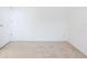 Empty bedroom with carpeted floor and door at 10721 Rockledge View Dr, Riverview, FL 33579