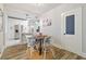 Bright dining area with four chairs and view of the kitchen at 111 W Ida St, Tampa, FL 33603