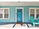 Bright blue front door adds a pop of color to the home's facade at 111 W Ida St, Tampa, FL 33603