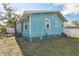 Side view of teal house with white trim at 111 W Ida St, Tampa, FL 33603