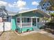 Quaint teal house with white porch at 111 W Ida St, Tampa, FL 33603