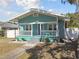 Quaint teal house with white porch at 111 W Ida St, Tampa, FL 33603