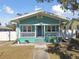 Quaint teal house with white porch at 111 W Ida St, Tampa, FL 33603