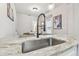 Sleek kitchen sink and faucet with granite countertops at 111 W Ida St, Tampa, FL 33603