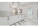 Modern kitchen with white cabinets, stainless steel appliances, and granite countertops at 111 W Ida St, Tampa, FL 33603