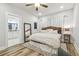 Main bedroom with a comfortable bed and access to the bathroom at 111 W Ida St, Tampa, FL 33603