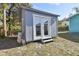 Gray storage shed with double doors at 111 W Ida St, Tampa, FL 33603