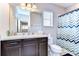 Bathroom featuring stylish chevron shower curtain, and a classic vanity at 11308 Great Neck Rd, Riverview, FL 33578