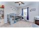 bedroom featuring bunkbeds with slide, ceiling fan and a neutral color palette at 11308 Great Neck Rd, Riverview, FL 33578