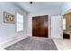 Bedroom featuring wood wardrobe and a large area rug at 11308 Great Neck Rd, Riverview, FL 33578