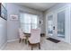 Bright breakfast nook featuring a round dining table, French doors and tile flooring at 11308 Great Neck Rd, Riverview, FL 33578