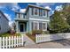 Charming two-story home with a well-manicured lawn and a classic white picket fence at 11308 Great Neck Rd, Riverview, FL 33578