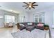 Spacious living room featuring a ceiling fan, lots of natural light and breakfast nook at 11308 Great Neck Rd, Riverview, FL 33578