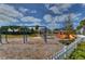 Community playground with swings, slides, a gazebo, and soft ground cover for safe play at 11308 Great Neck Rd, Riverview, FL 33578