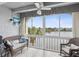 Relaxing balcony with wicker furniture and lake view at 11485 Oakhurst Dr # 1100-312, Largo, FL 33774