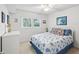 Bright bedroom with a comfortable bed and ceiling fan at 11485 Oakhurst Dr # 1100-312, Largo, FL 33774