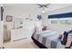 Nautical-themed bedroom with dresser, desk, and ceiling fan at 11485 Oakhurst Dr # 1100-312, Largo, FL 33774