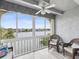 Relaxing lanai with lake view and wicker furniture at 11485 Oakhurst Dr # 1100-312, Largo, FL 33774