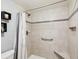 Large walk-in shower with tiled walls at 11485 Oakhurst Dr # 1100-312, Largo, FL 33774