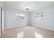 Spacious bedroom with tiled floors and large windows at 1243 Bayshore Dr, Terra Ceia, FL 34250