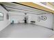 Spacious garage with extra storage and epoxy flooring at 1243 Bayshore Dr, Terra Ceia, FL 34250