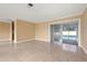 Bright living room with tile floors and access to the pool at 1243 Bayshore Dr, Terra Ceia, FL 34250