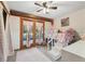 Charming bedroom with a bunk bed and French doors at 13345 14Th St, Dade City, FL 33525