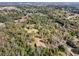 Wide shot of the house and surrounding neighborhood at 13345 14Th St, Dade City, FL 33525