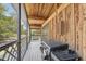 Screened porch with a grill and wooden flooring at 13345 14Th St, Dade City, FL 33525