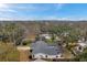 Aerial view of house, showcasing backyard oasis, pool, and neighborhood landscape at 1753 Lucas Dr, Clearwater, FL 33759