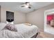 Simple bedroom with double bed and access to another room at 1753 Lucas Dr, Clearwater, FL 33759