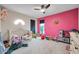 bedroom with playful decor, plenty of storage, and a ceiling fan at 1753 Lucas Dr, Clearwater, FL 33759