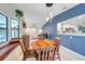 Charming dining area with a rustic table and built-in bench seating at 1753 Lucas Dr, Clearwater, FL 33759