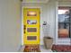 Inviting yellow front door with modern design at 1753 Lucas Dr, Clearwater, FL 33759