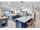 Renovated kitchen with stainless steel appliances, quartz countertops, and blue cabinetry at 1753 Lucas Dr, Clearwater, FL 33759