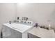 Laundry room with washer, dryer, and utility sink at 1753 Lucas Dr, Clearwater, FL 33759