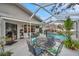 Covered patio overlooking the refreshing pool at 1753 Lucas Dr, Clearwater, FL 33759