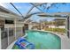 Relaxing kidney-shaped pool with safety fence at 1753 Lucas Dr, Clearwater, FL 33759