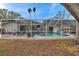 Refreshing pool area with screened enclosure and patio at 1753 Lucas Dr, Clearwater, FL 33759