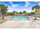 Inviting community pool with lounge chairs and a relaxing atmosphere at 17806 Althea Blue Pl, Lutz, FL 33558