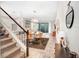 Elegant dining area with glass table, modern light fixture, and hardwood floors at 17806 Althea Blue Pl, Lutz, FL 33558