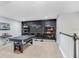 Game room with pool table, shelving, and a black accent wall at 17806 Althea Blue Pl, Lutz, FL 33558