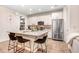 Modern kitchen island with granite countertops and bar seating at 17806 Althea Blue Pl, Lutz, FL 33558