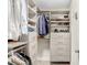 Large walk-in closet featuring built-in shelves and drawers at 17806 Althea Blue Pl, Lutz, FL 33558