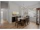 Elegant dining room with chandelier and a six-person table at 19145 Cherry Rose Cir, Lutz, FL 33558